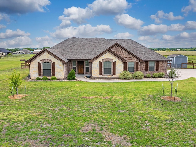 single story home featuring a front yard