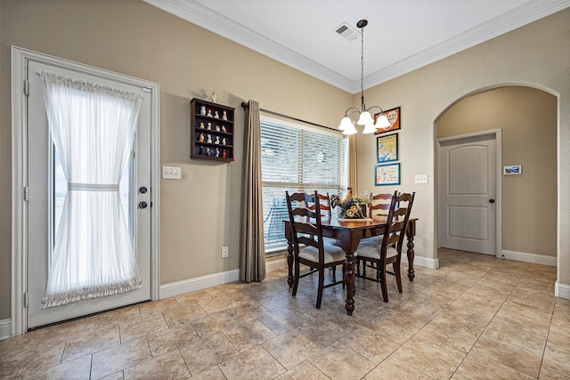 dining area with an inviting chandelier and crown molding