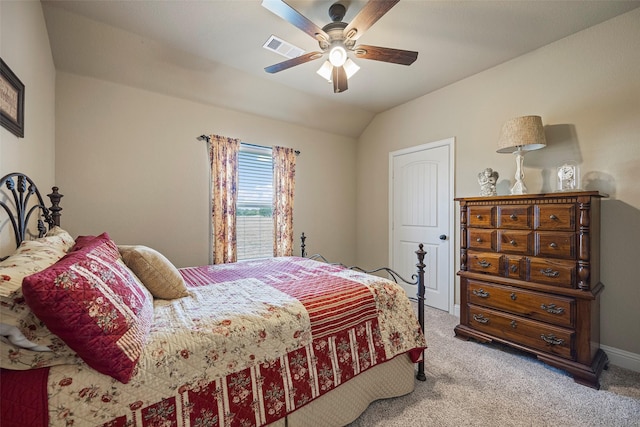 carpeted bedroom featuring ceiling fan and lofted ceiling