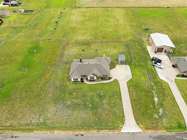 birds eye view of property with a rural view