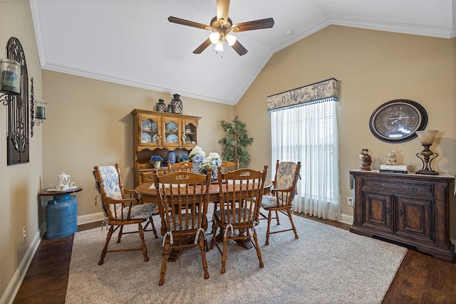 dining room featuring ornamental molding, dark hardwood / wood-style flooring, ceiling fan, and lofted ceiling