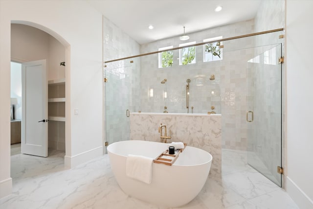 bathroom featuring shower with separate bathtub and tile patterned floors