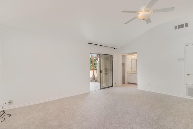 unfurnished room with ceiling fan, light colored carpet, and vaulted ceiling