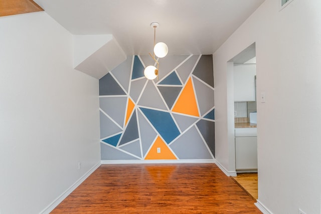 unfurnished dining area with hardwood / wood-style floors