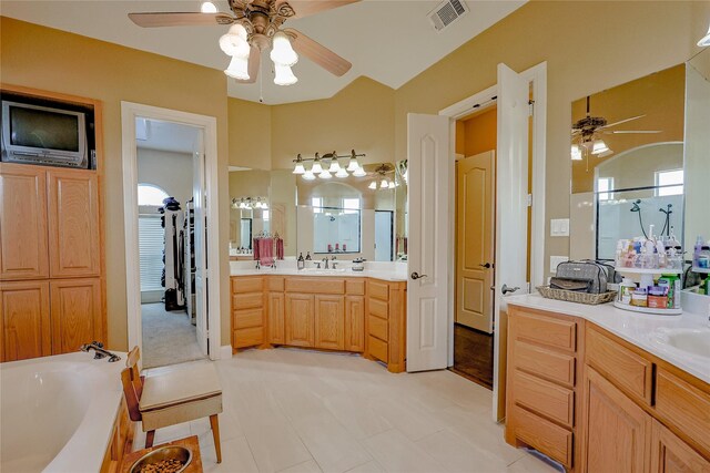 bathroom with ceiling fan, vanity, and shower with separate bathtub