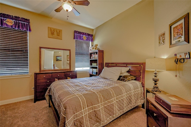 bedroom featuring ceiling fan and light colored carpet