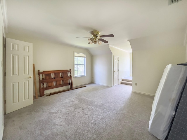 bonus room with ceiling fan, light colored carpet, and lofted ceiling