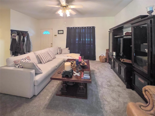 carpeted living room featuring ceiling fan