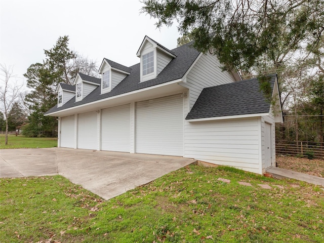 view of home's exterior featuring a lawn and a garage