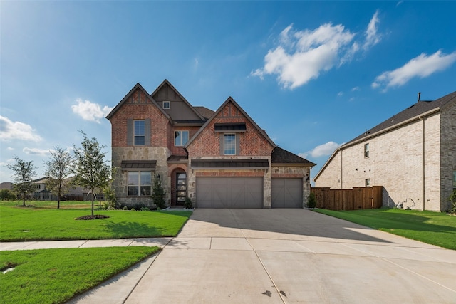 view of front of property with a garage and a front lawn