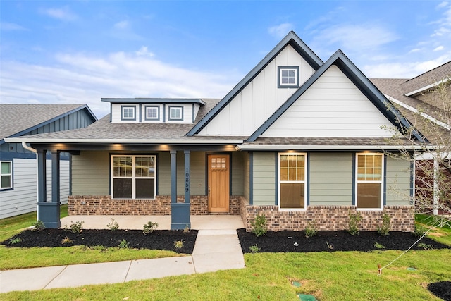 view of front of property with a front lawn and a porch