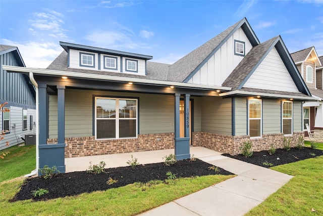 view of front of property with central AC and a porch