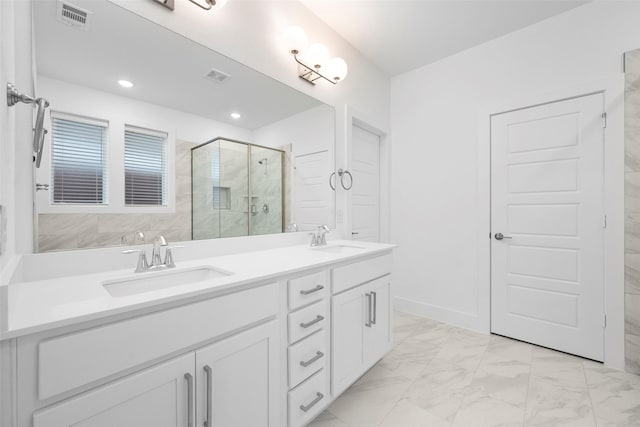 bathroom featuring vanity and an enclosed shower