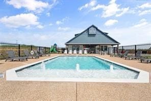 view of swimming pool with a patio area and pool water feature