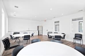 dining space featuring wood-type flooring