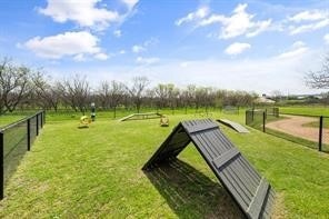 view of home's community with a lawn