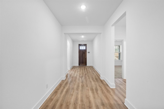 hall with light hardwood / wood-style floors