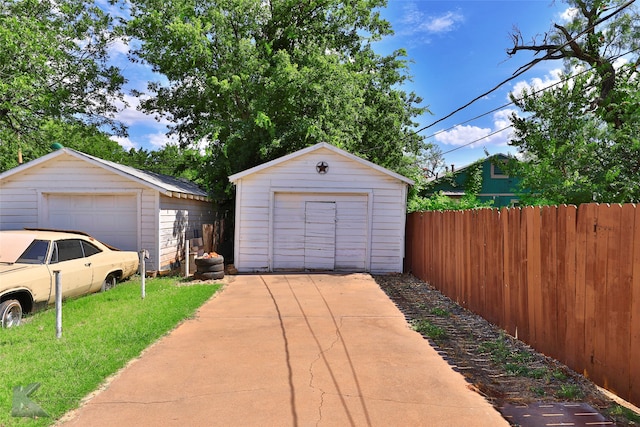 garage featuring a lawn