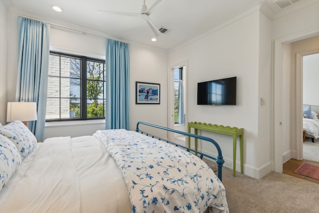 carpeted bedroom featuring crown molding and ceiling fan