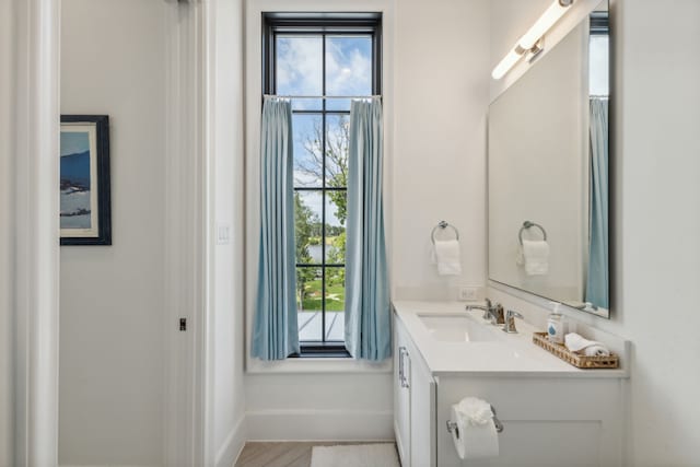 bathroom featuring tile flooring and vanity