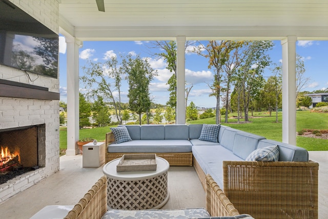 view of patio featuring an outdoor living space with a fireplace