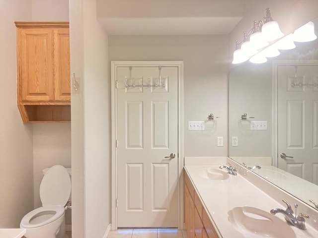 12308 Riviera Rd, Frisco, TX 75035 - bathroom featuring a sink, tile patterned floors, toilet, and double vanity