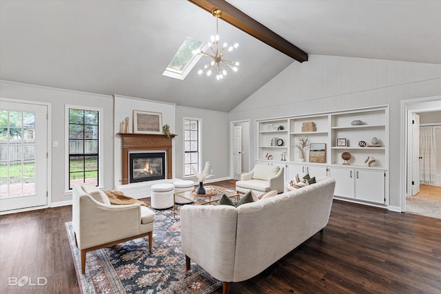 living room with a notable chandelier, a fireplace, dark wood-type flooring, and a healthy amount of sunlight