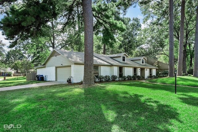 view of front facade featuring a garage and a front lawn