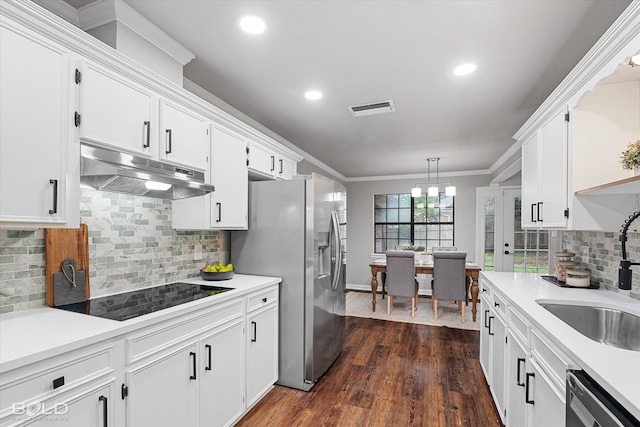 kitchen with white cabinetry, appliances with stainless steel finishes, and dark wood-type flooring