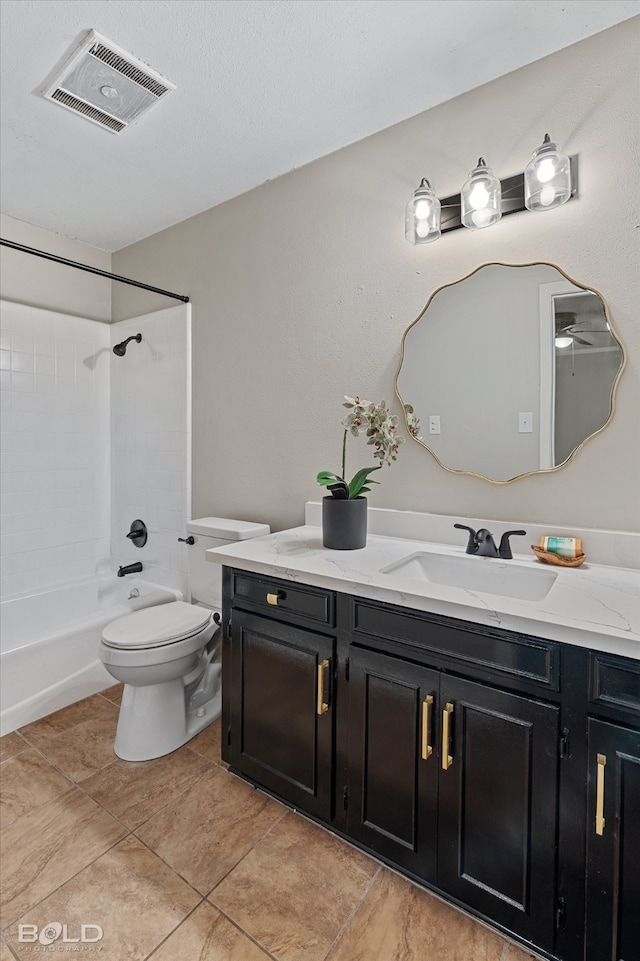 full bathroom featuring tub / shower combination, tile patterned flooring, vanity, and toilet