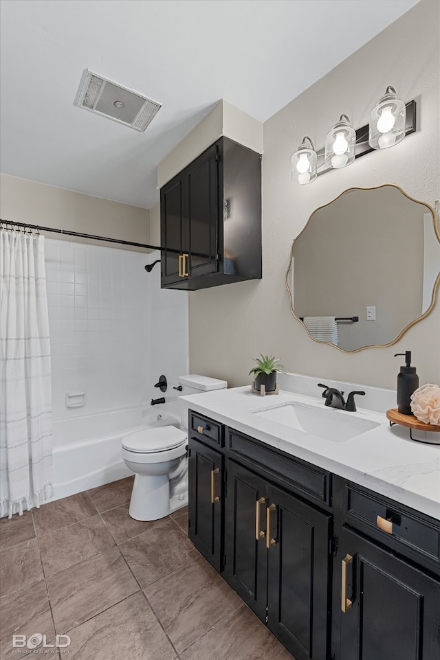 full bathroom featuring vanity, shower / bath combo with shower curtain, and toilet