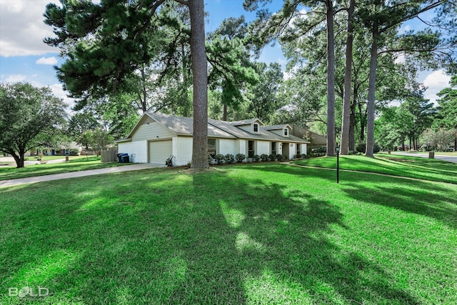 ranch-style home with a front yard and a garage