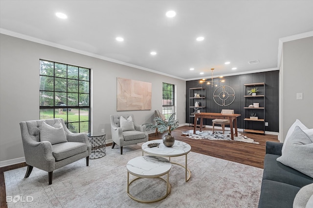 living room with ornamental molding and light wood-type flooring