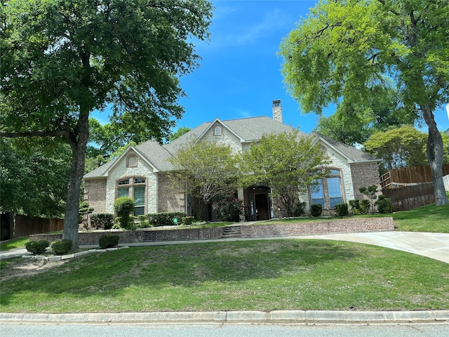 view of front of property with a front lawn