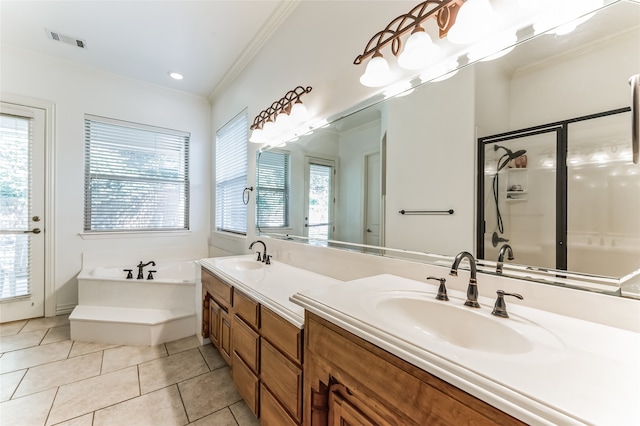 bathroom featuring double vanity, tile patterned floors, plus walk in shower, and a wealth of natural light