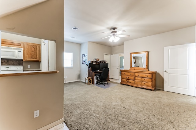 office area with light carpet and ceiling fan