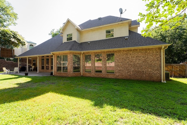 216 Laurel Creek Dr, Sherman, TX 75092 - back of house featuring a patio, brick siding, and a shingled roof