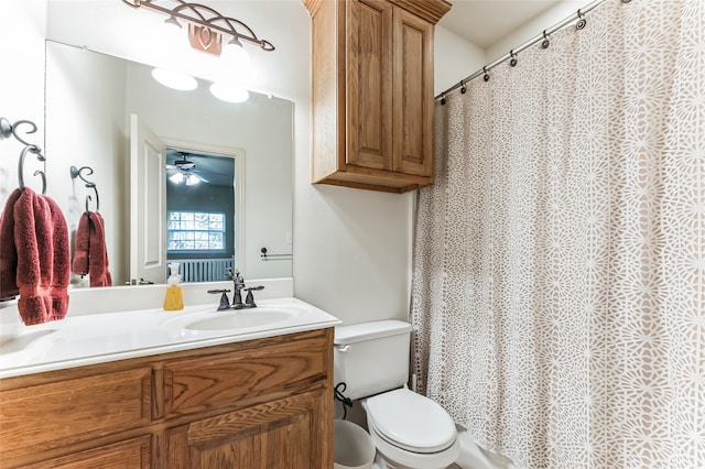 bathroom with vanity, toilet, and ceiling fan