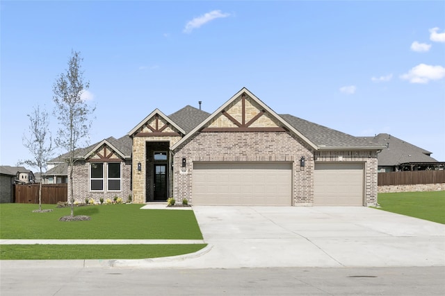 view of front facade featuring a front lawn and a garage