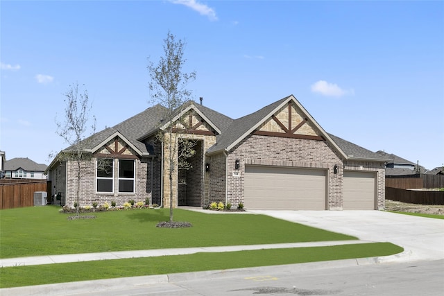 view of front of property featuring central AC, a garage, and a front lawn