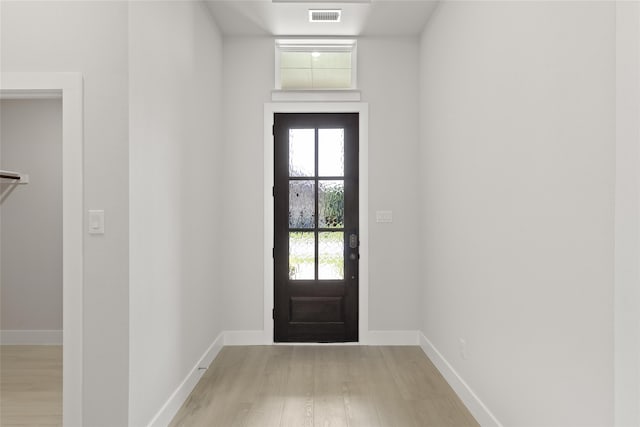 doorway with light hardwood / wood-style floors