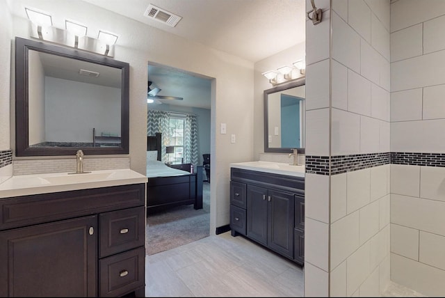 bathroom with vanity and ceiling fan