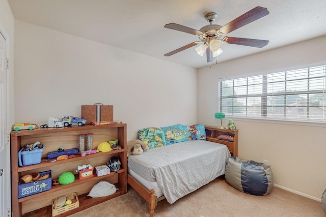 carpeted bedroom with ceiling fan