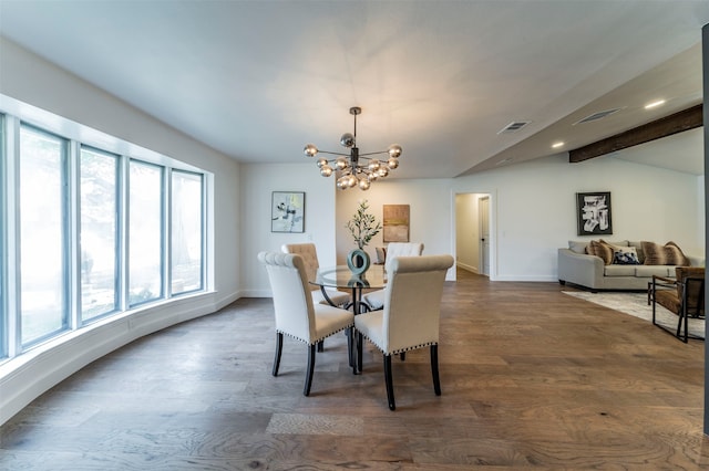 dining space with dark hardwood / wood-style floors, beam ceiling, and an inviting chandelier