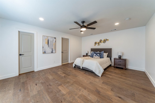 bedroom with ceiling fan and dark hardwood / wood-style flooring