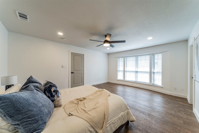 bedroom featuring hardwood / wood-style flooring and ceiling fan