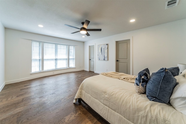 bedroom with dark wood-type flooring and ceiling fan