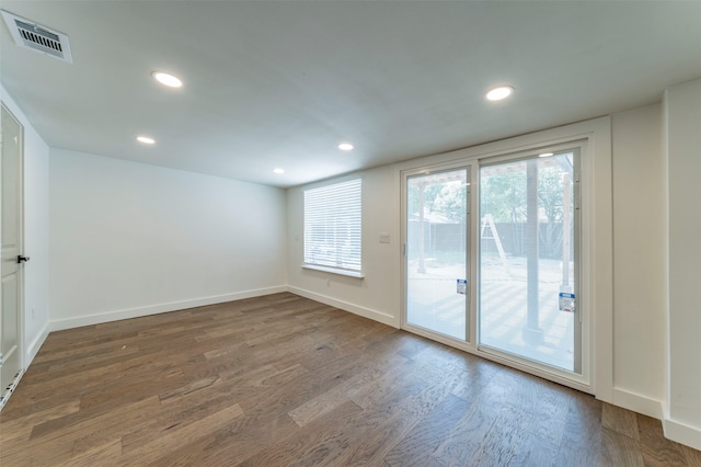 empty room featuring hardwood / wood-style floors