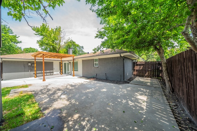 rear view of property with a patio area