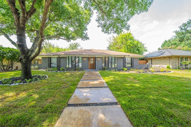 ranch-style house with a front lawn